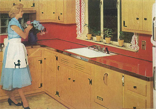 Vintage-kitchen-with-red-laminate-counters-and-metal-edging